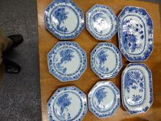 A SET OF SIX CHINESE BLUE AND WHITE OCTAGONAL PLATES PAINTED WITH A BRIDGE FROM AN ISLAND. W 22.5cms