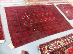 THREE AFGHAN BOKHARA RUGS. LARGEST. 195 x 127cms. (3)