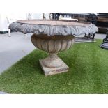 A LARGE VICTORIAN STYLE CAST IRON CLASSICAL GARDEN URN OF SQUAT FORM WITH FLUTED DECORATION. Dia.