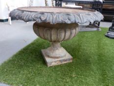 A LARGE VICTORIAN STYLE CAST IRON CLASSICAL GARDEN URN OF SQUAT FORM WITH FLUTED DECORATION. Dia.