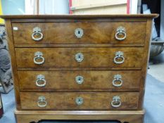 A 19th.C.FRENCH WALNUT CHEST OF FOUR LONG DRAWERS WITH GILT BRASS HANDLES, ON SHAPED PLINTH BASE.