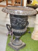 A PAIR OF OLD CAST IRON CLASSICAL VICTORIAN STYLE GARDEN URNS ON SQUARE BASES. Dia.48 x H.60cms.