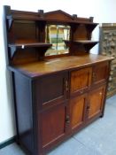 AN ARTS AND CRAFTS 1/4 SAWN OAK SIDE CABINET WITH RAISED SHELF BACK OVER ARRANGEMENT OF CABINET DOOR