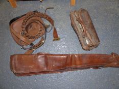 A LEATHER AND FUR LINED DOUBLE GUN SLIP, A LEATHER PANNIER BAG, TWO CARTRIDGE BELTS AND A SMALL