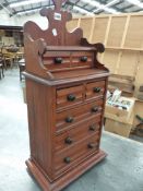 A VICTORIAN PITCH PINE MINIATURE CHEST OF SEVEN DRAWERS. 36 x 21 x H.79cms.