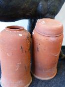 A GROUP OF THREE EARLY 20th.C.TERRACOTTA RHUBARB FORCERS, ONE WITH A LID. H.86cms. (4)