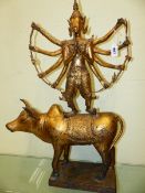 A LARGE GILT BRONZE FIGURE OF THE HINDU GOD DURGA? STANDING ATOP A BUFFALO (MAHISHA?) ON A