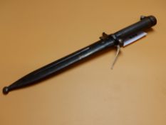 A MAUSER FITTING BAYONET AND IRON SCABBARD STAMPED 5/125 NO. 736 ON THE GUARD AND 4/125 NO. 668 ON