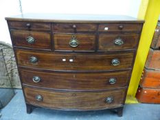 A LATE GEORGIAN MAHOGANY AND INLAID BOW FRONT CHEST OF ONE SHALLOW DRAWER OVER THREE SHORT AND THREE