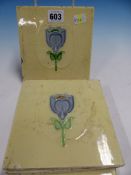 FIVE POTTERY TILES EACH WITH A BLUE FLOWER STEM IN ART NOUVEAU TASTE ON A PALE LEMON YELLOW