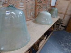 THREE ANTIQUE GLASS BELL CLOCHES. (3)