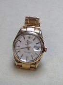 A VINTAGE ROLEX OYSTER PERPETUAL WATCH WITH DATE. WATCH REF NUMBER 1550 POSSIBLY "GOLDEN EGG".