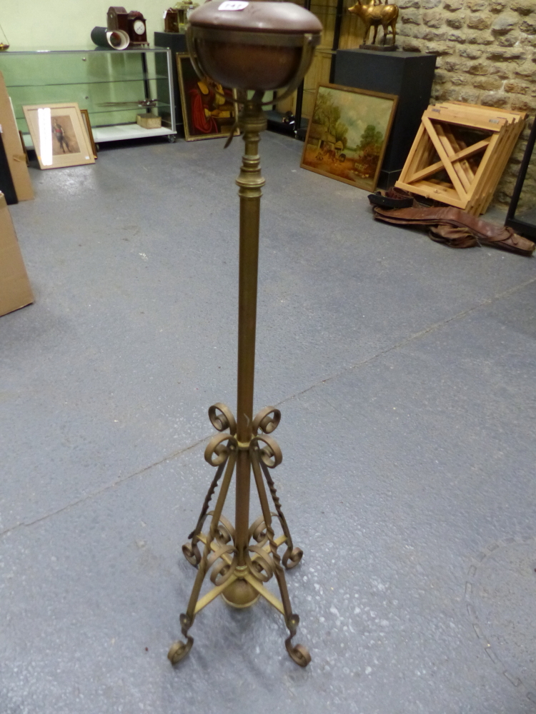 A VICTORIAN ARTS AND CRAFTS STYLE BRASS OIL LAMPSTAND OF ADJUSTABLE HEIGHT.