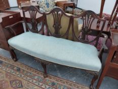 AN ANTIQUE STYLE MAHOGANY TRIPLE CHAIR BACK SETTEE ON CARVED CABRIOLE LEGS WITH CLAW AND BALL
