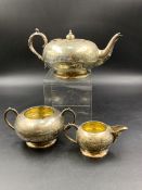 AN EDWARDIAN SILVER HALLMARKED THREE PART TEA SET DATED 1909-1910 CHESTER AND BIRMINGHAM FOR S.