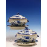 A PAIR OF CHINESE EXPORT BLUE AND WHITE SAUCE TUREENS, COVERS AND STANDS PAINTED WITH FLOWERS