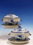 A PAIR OF CHINESE EXPORT BLUE AND WHITE SAUCE TUREENS, COVERS AND STANDS PAINTED WITH FLOWERS