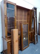 A LARGE VICTORIAN OAK INVERTED BREAKFRONT LIBRARY BOOKCASE WITH FOUR TALL GLAZED DOORS OVER A PAIR