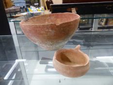 AN OLD TESTAMENT TERRACOTTA BOWL. Dia. 26cms TOGETHER WITH A DIPPER CUP WITH HANDLE TO ONE SIDE, THE