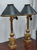 A PAIR OF GOOD BESPOKE GILT BRASS TABLE LAMPS OF 18th.C.DESIGN WITH TOLE SHADES. H.70cms.