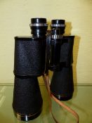 A LEATHER CASED PAIR OF LIEBERMAN & GORTZ 12 X 65 BINOCULARS.