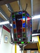 AN IMPRESSIVE BRONZE FRAMED HEXAGONAL HALL LANTERN WITH STAINED GLASS PANELS. MAX Dia.80cms x H.
