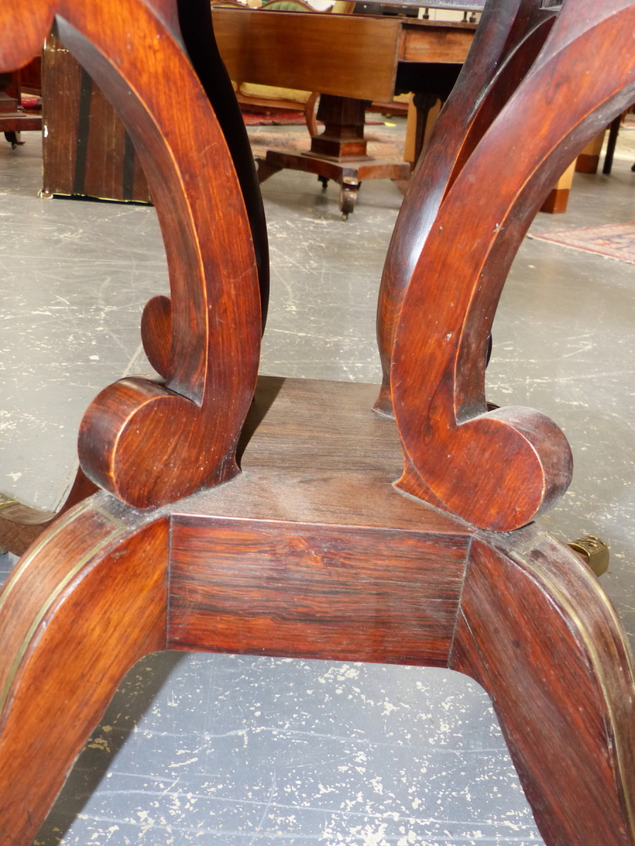 A REGENCY ROSEWOOD AND BRASS INLAID TILT TOP BREAKFAST TABLE ON QUADRUPED SABRE LEGS. 98 x 140 x H. - Image 12 of 14
