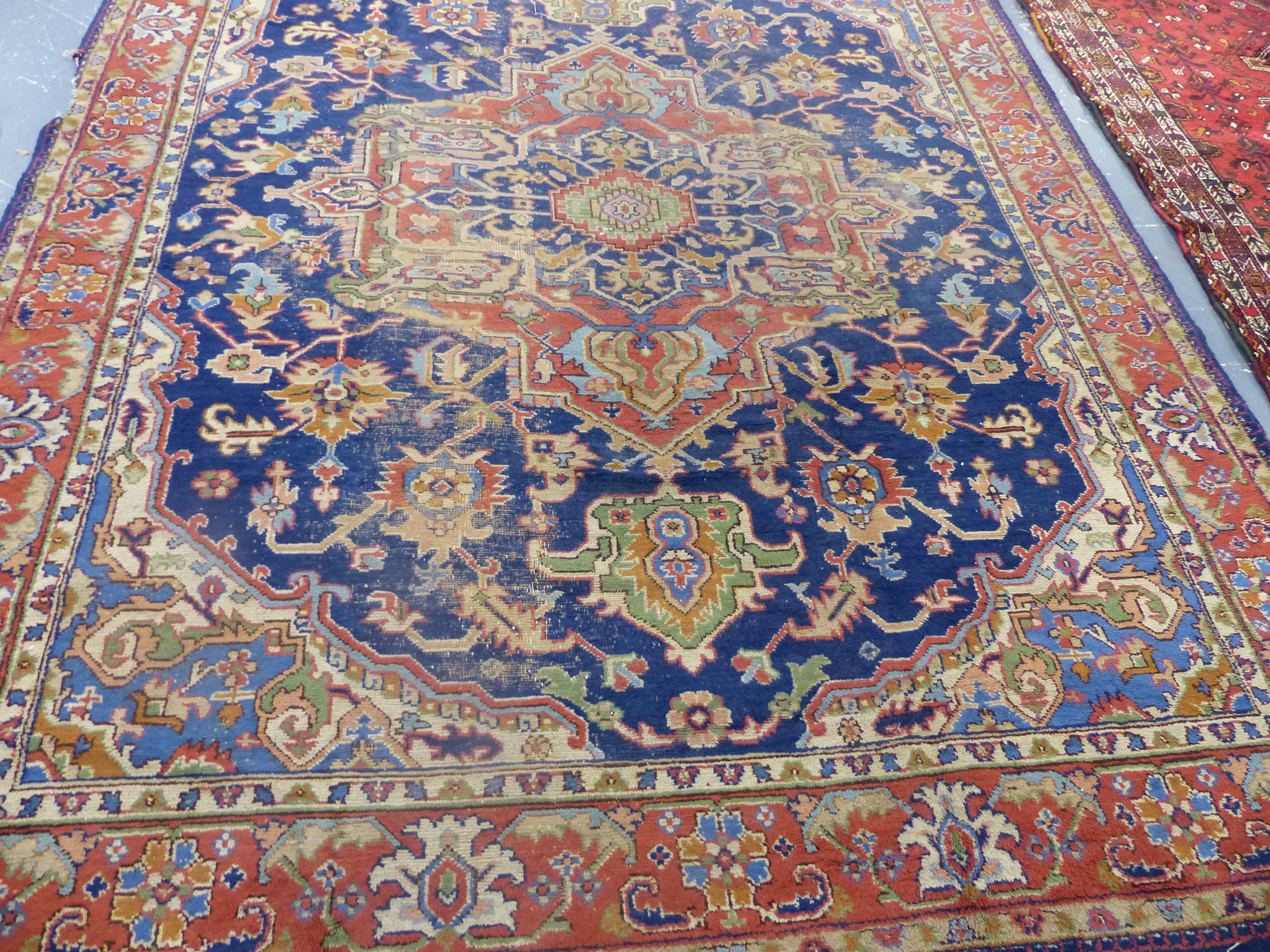 AN ORIENTAL CARPET OF PERSIAN HERIZ DESIGN. 360 x 283cms.