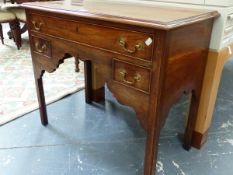 A MAHOGANY LOW BOY, THE CYMA EDGED TOP OVER A LONG DRAWER AND TWO SHORT DRAWERS ON SQUARE