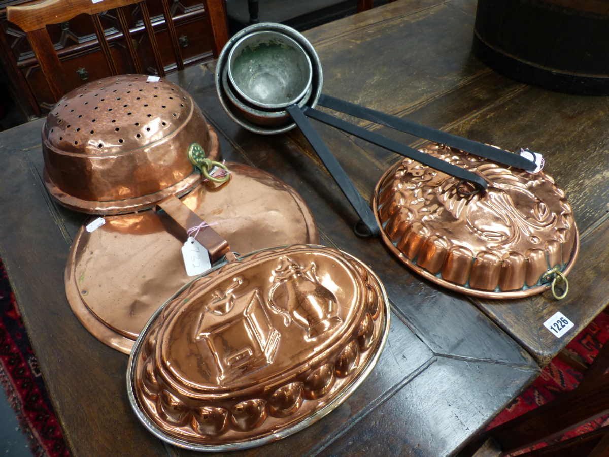 THREE COPPER AND WROUGHT IRON LADLES, A LARGE COPPER MOULD, A COPPER PAN LID AND A SIEVE. (6)