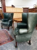 A PAIR OF GEO.II.STYLE LEATHER UPHOLSTERED BARREL WING BACK ARMCHAIRS ON SQUARE TAPERED FORELEGS