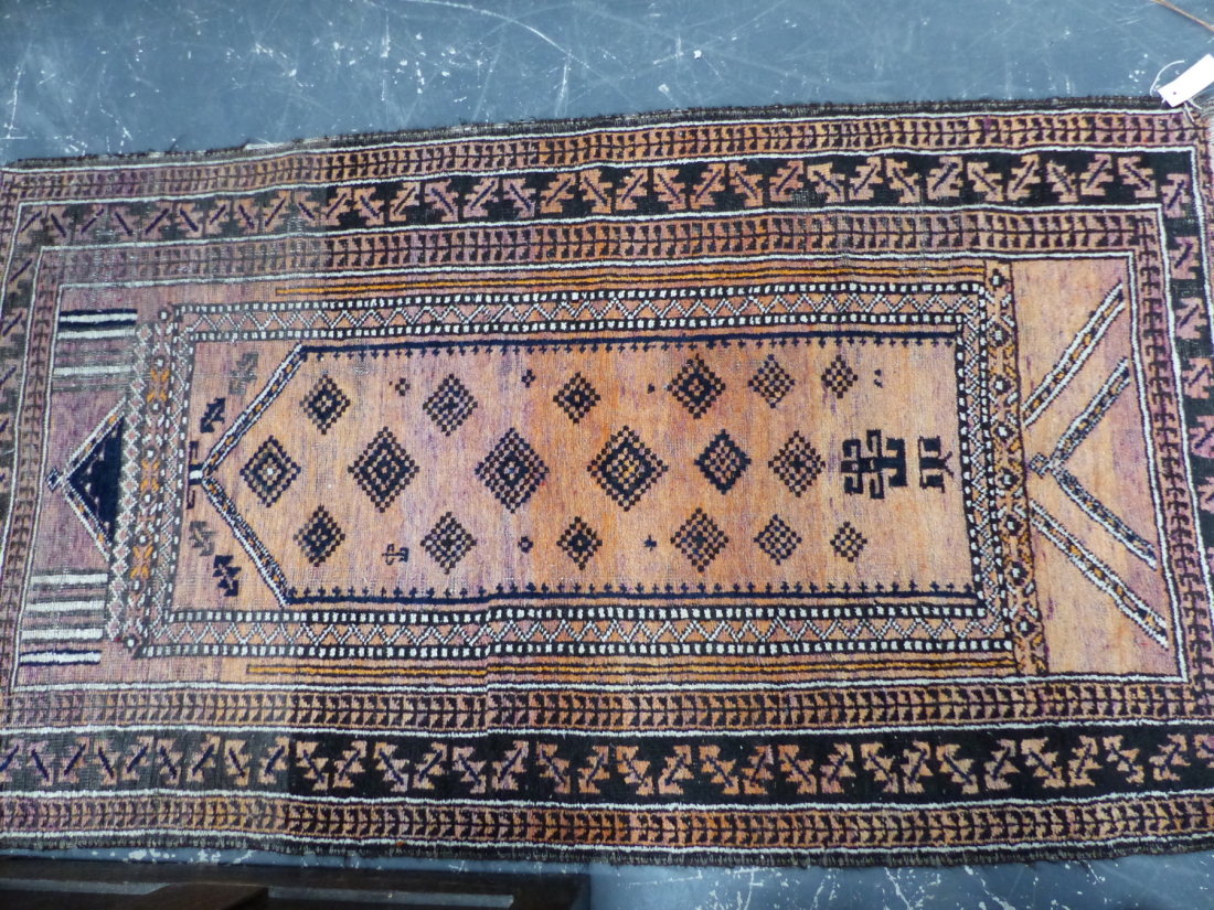AN ANTIQUE BELOUCH RUG. 225 x 114cms TOGETHER WITH THREE TRIBAL BELOUCH PRAYER RUGS. (4) - Image 4 of 4
