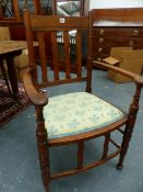A SET OF TWELVE ARTS AND CRAFTS DINING CHAIRS WITH WAVY SLAT BACKS. TO INCLUDE TWO ARMCHAIRS. (12)