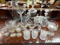 A COLLECTION OF CLEAR GLASS TO INCLUDE DECANTERS, CARAFES, SALAD SIDE PLATES, A JUG, SWEETMEATS