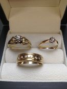 THREE GOLD AND DIAMOND SET RINGS TO INCLUDE TWO DIAMOND SOLITAIRES (FINGER SIZE N AND S) AND A FLUSH