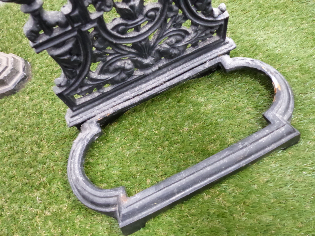 A CAST IRON STICK STAND, THE ROUND ARCH FLORAL BACK PANEL ABOVE REMOVABLE TWO COMPARTMENTAL TRAY. - Image 4 of 5