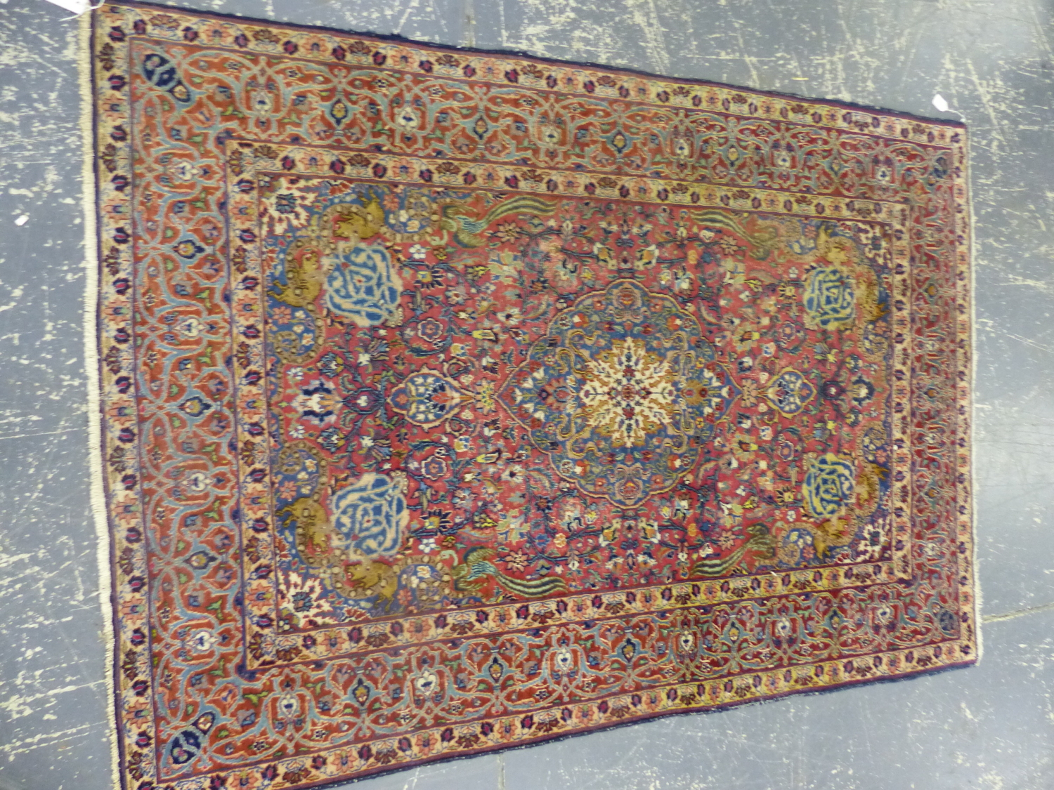 AN ANTIQUE PERSIAN ANIMAL DESIGN RUG. 210 x 147cms.