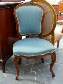 TWO SIMILAR FRENCH WALNUT SALON SIDE CHAIRS WITH CARVED SHOW FRAMES ON CABRIOLE LEGS. (2)