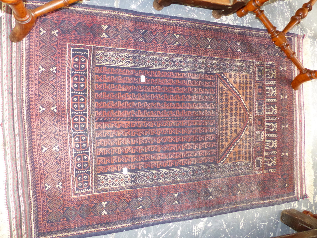 AN ANTIQUE BELOUCH RUG. 225 x 114cms TOGETHER WITH THREE TRIBAL BELOUCH PRAYER RUGS. (4) - Image 3 of 4