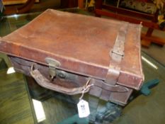 A BRASS BOUND LEATHER CARTRIDGE MAGAZINE, PRIESTLEY, COTTINGLY HALL.