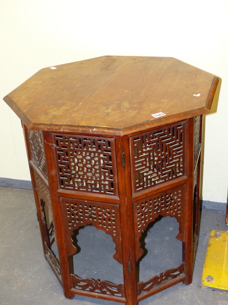 A HARDWOOD EASTERN MOORISH STYLE OCTAGONAL TABLE WITH PIERCED DECORATION. W.60 x H.62cms.