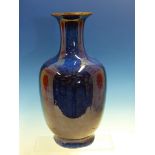 A CHINESE FLAMBE BALUSTER VASE, THE BROWN EDGED FLARED RIM ABOVE A SPECKLED BLUE GLAZED BODY, SIX