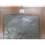 AN EARLY 20th.C. BRONZED PLASTER PROFILE OF A CHILD IN WOODEN FRAME, MONOGRAMMED F C. 41 x 31.5cms.