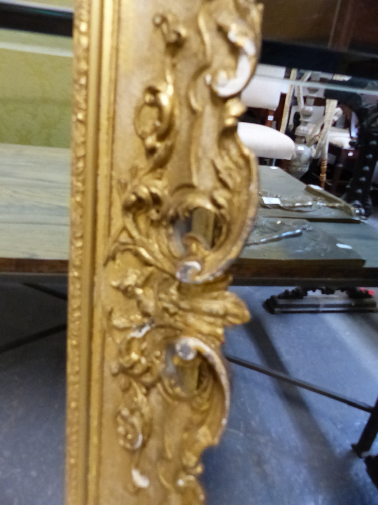 A LARGE VICTORIAN SWEPT GILT PICTURE FRAME IN THE FRENCH STYLE. REBATE 69 x 99.5cms. - Image 2 of 8