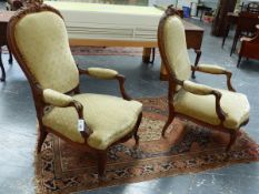 A PAIR OF FRENCH LOUIS XV STYLE CARVED OAK SALON ARM CHAIRS.