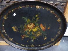 A VICTORIAN PAPIER MACHE OVAL TRAY WITH PAINTED DECORATION. 74 x 59cms.