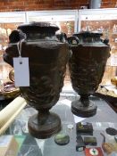 A PAIR OF ANTIQUE REPOUSSE COPPER LAMP BASES OR URNS WITH CLASSICAL DECORATION