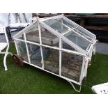 A RARE VINTAGE WHEELED GARDEN CLOCHE OR MINIATURE GREENHOUSE WITH RISING VENT TOP AND FOLDING BARROW