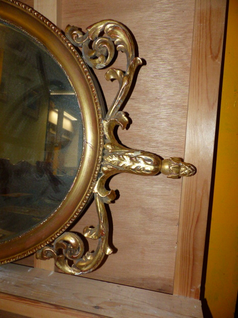 A 19th.C.OVAL MIRROR WITH GILT FOLIATE CREST AND BASE. 104 x 52cms. - Image 2 of 4