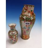 TWO CANTON VASES BOTH PAINTED WITH FIGURE AND GARDEN RESERVES, THE LARGER OF BALUSTER SHAPE. H 26.